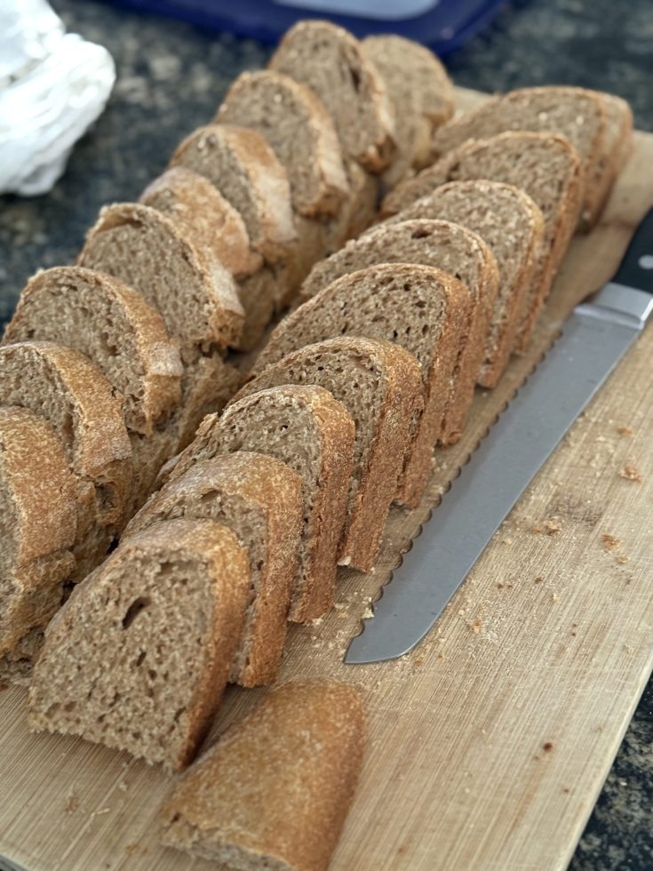 Slice Einkorn Spelt bread resting on a cutting board